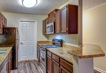 Granite Counter Tops In Kitchen at Wynfield Trace, Peachtree Corners, Georgia